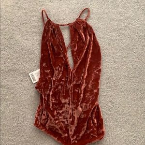 Rose colored velvet body suit